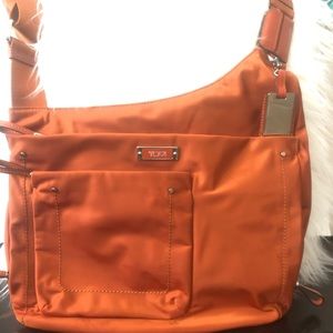Orange Tumi Crossover bag